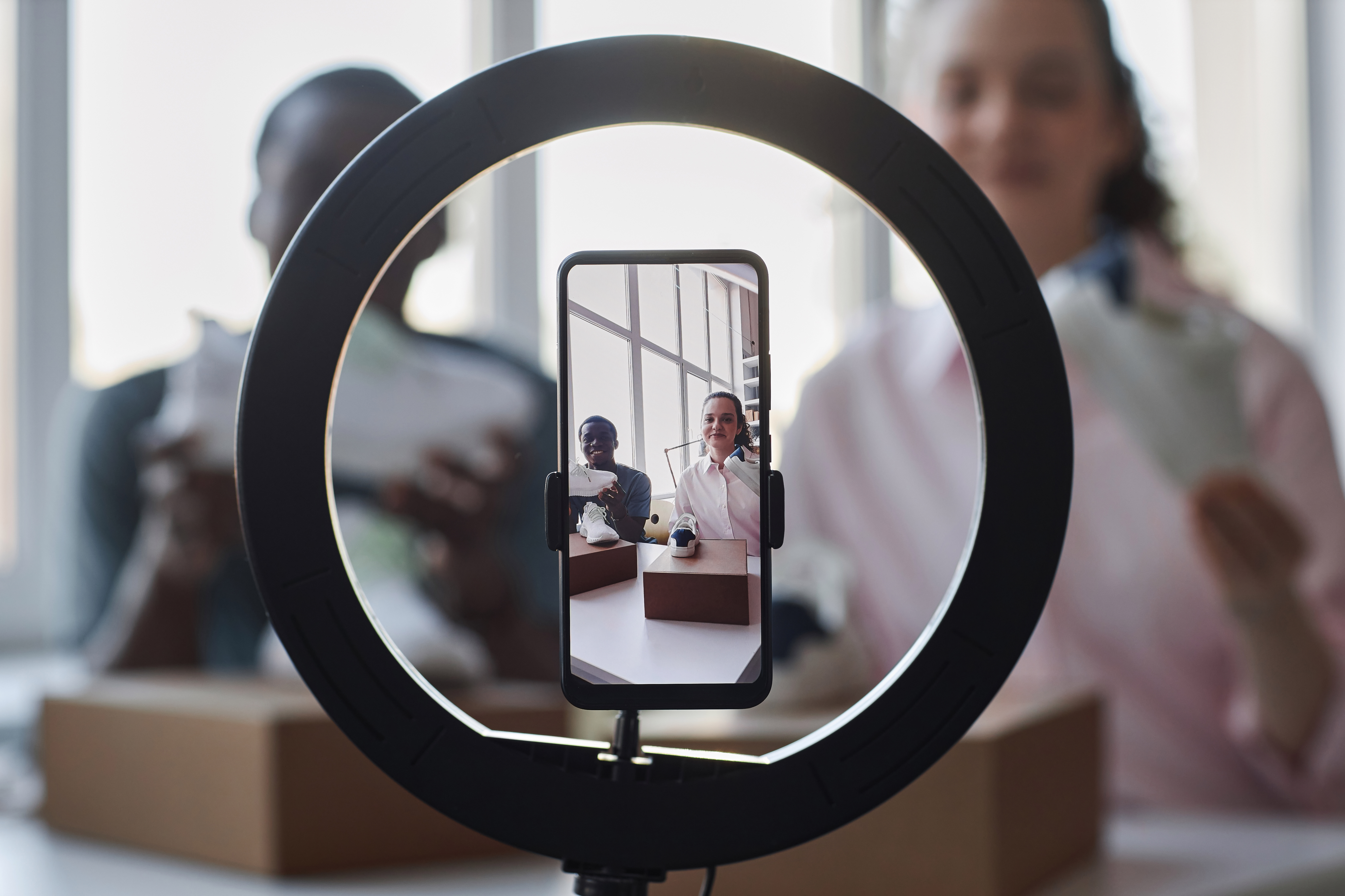 Creators filming product content on a smartphone