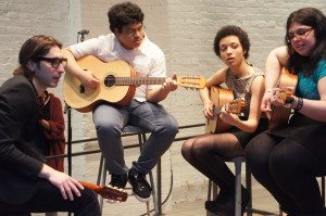 Pictured here are students participating in the Music Unites Guitar Program. It focuses on helping student to understand the guitar and musical performance. (Photo courtesy of Kyle Alfred)