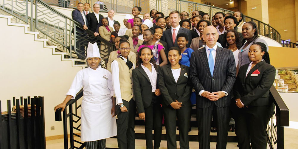 At the Kigali Marriott Hotel hotel opening, employees stand with Arne Sorenson, President and CEO of Marriott International, and other Marriott executives. (Photo: Marriott International)