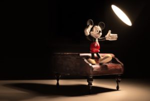 Mickey mouse standing at the spotlight